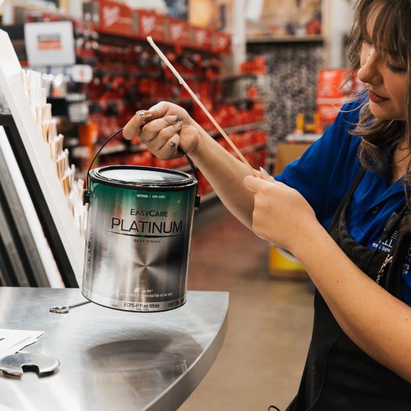Employee Mixing Up Can of Paint for Customer